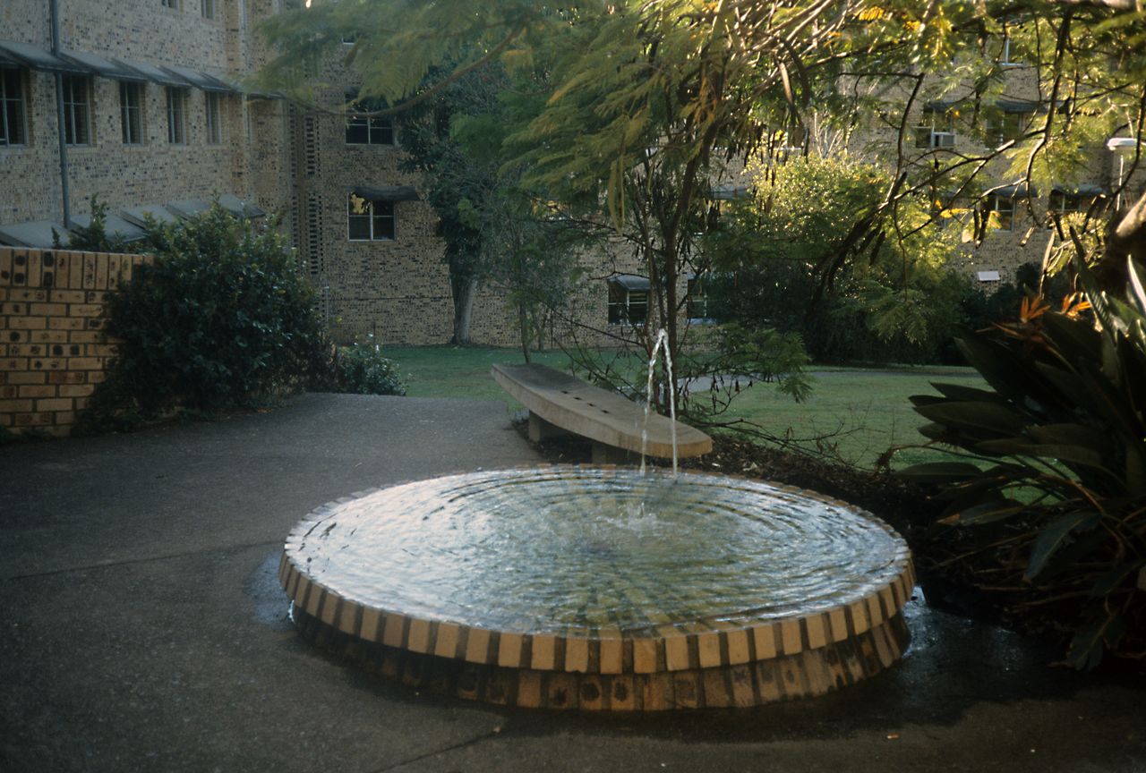 brick fountain in courtyard created by hartley teakle